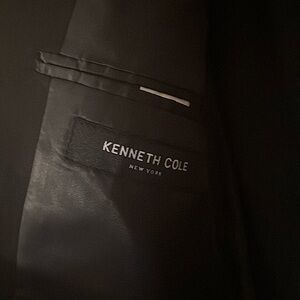 Kenneth Cole black suit. Suit jacket is 38L. Pants are 32×32.